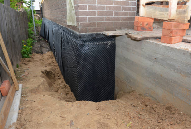 Happy homeowners after waterproofing job in Cherry Fork
